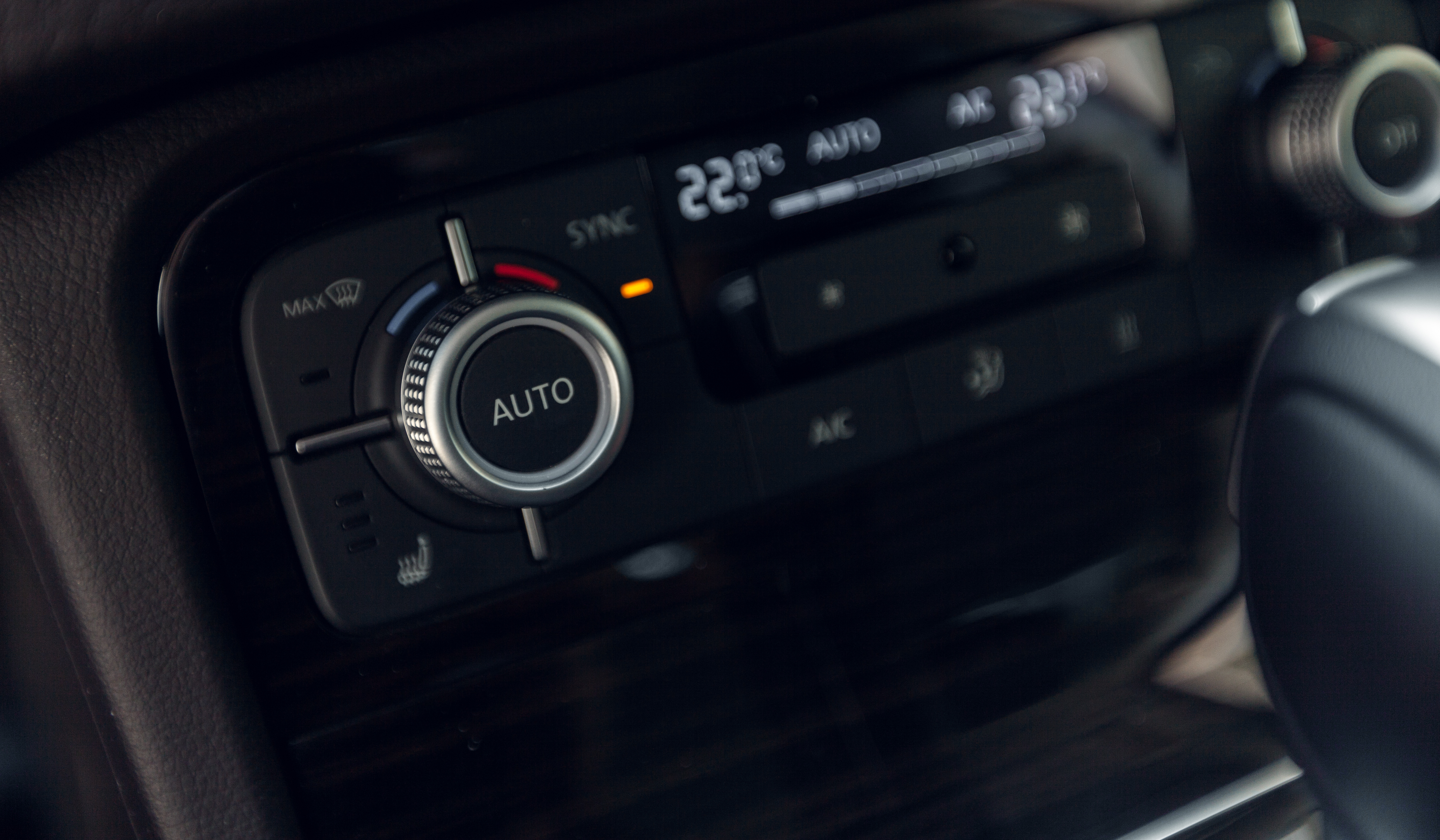 Close-up of a car climate control panel for air conditioning servicing